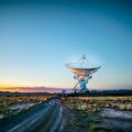 white radar telescope on grass field